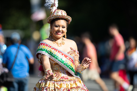 Washington, D.C., USA - September 29, 2018: The Fiesta DC Parade, Bolivian women wearing traditional clothing performing a traditional dance from boliviaのeditorial素材