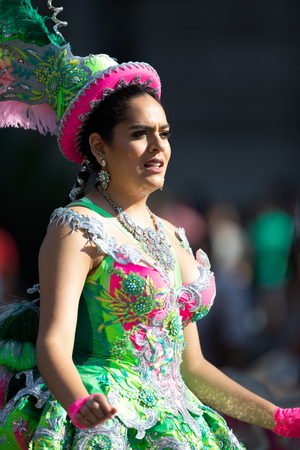 Washington, D.C., USA - September 29, 2018: The Fiesta DC Parade, Bolivian women wearing traditional clothing performing a traditional dance from boliviaのeditorial素材