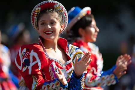 Washington, D.C., USA - September 29, 2018: The Fiesta DC Parade, Bolivian women wearing traditional clothing performing a traditional dance from boliviaのeditorial素材