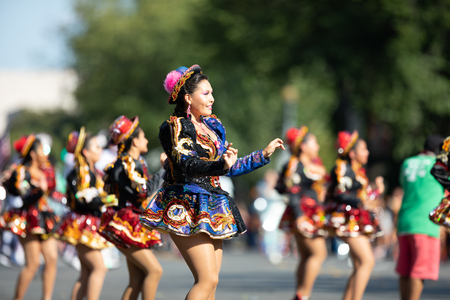 Washington, D.C., USA - September 29, 2018: The Fiesta DC Parade, Bolivian women wearing traditional clothing performing a traditional dance from boliviaのeditorial素材