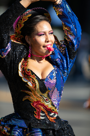 Washington, D.C., USA - September 29, 2018: The Fiesta DC Parade, Bolivian women wearing traditional clothing performing a traditional dance from boliviaのeditorial素材