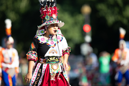 Washington, D.C., USA - September 29, 2018: The Fiesta DC Parade, Bolivian women wearing traditional clothing performing a traditional dance from boliviaのeditorial素材