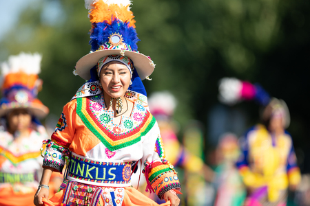 Washington, D.C., USA - September 29, 2018: The Fiesta DC Parade, Bolivian women wearing traditional clothing performing a traditional dance from boliviaのeditorial素材