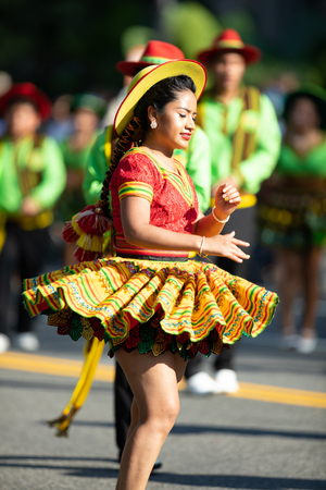 Washington, D.C., USA - September 29, 2018: The Fiesta DC Parade, Bolivian women wearing traditional clothing performing a traditional dance from boliviaのeditorial素材