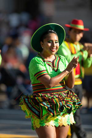Washington, D.C., USA - September 29, 2018: The Fiesta DC Parade, Bolivian women wearing traditional clothing performing a traditional dance from boliviaのeditorial素材