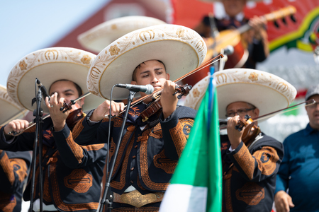 Chicago, Illinois , USA - September 9, 2018 The 26th Street Mexican Independence Parade, mexican men wearing traditional mariachi clothing playing the Violinのeditorial素材