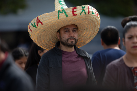 Chicago, Illinois , USA - September 9, 2018 The 26th Street Mexican Independence Parade, mexican man wearing a big sombrero with the slogan Viva Mexico during the paradeのeditorial素材