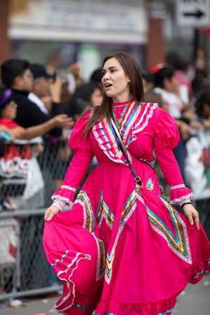 Chicago, Illinois , USA - September 9, 2018 The 26th Street Mexican Independence Parade, Mexican woman wearing traditional clothing dancingのeditorial素材