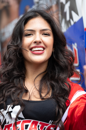 Chicago, Illinois , USA - September 9, 2018 The 26th Street Mexican Independence Parade, young woman on top of a float promoting the beer brand Tecate and boxingのeditorial素材