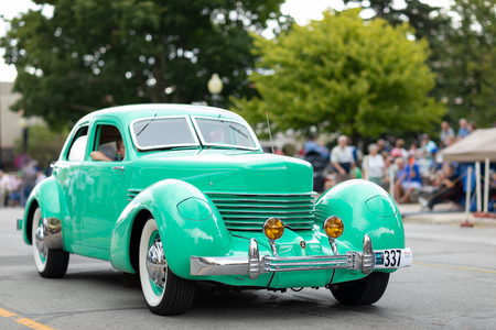 Auburn, Indiana, USA - September 9, 2018 The Auburn Cord Duesenberg Festival, A Cord classic car driving down the street during the paradeのeditorial素材