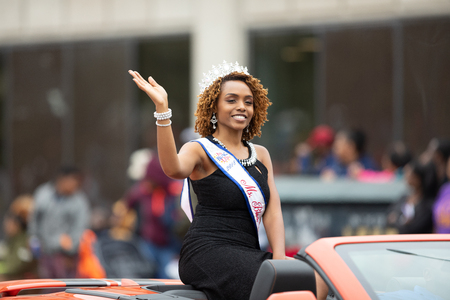 Indianapolis, Indiana, USA - September 22, 2018: The Circle City Classic Parade, African American Beauty Queem riding a car going down the road  during the paradeのeditorial素材