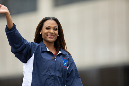 Indianapolis, Indiana, USA - September 22, 2018: The Circle City Classic Parade, African american cheerleader from Howard University Bison Cheerleading walking down the street paradeのeditorial素材