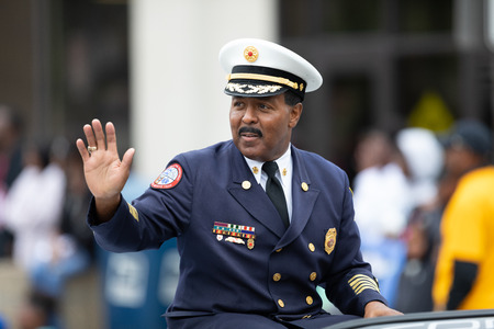 Indianapolis, Indiana, USA - September 22, 2018: The Circle City Classic Parade, Chief of the indianapolis Fire Department, on a car going down the roadのeditorial素材