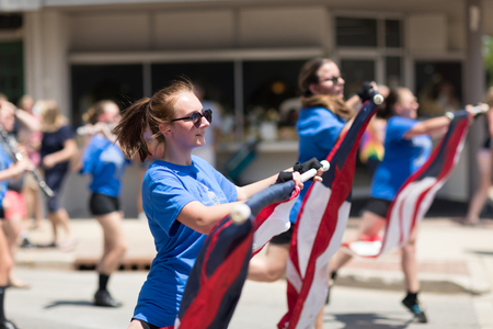 Kokomo, Indiana, USA - June 30, 2018: Haynes Apperson Parade, The Kokomo High School Marching Wildkats performing at the parade and wearing shirts that say Statuesqueのeditorial素材