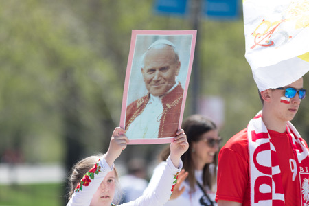Chicago, Illinois, USA - May 5, 2018: The Polish Constitution Day Parade, Polish girl wearing...
