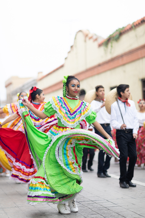 Matamoros, Tamaulipas, Mexico - November 20, 2018: The November 20 Parade, Young women and men dancing wearing traditional mexican clothing during the paradeのeditorial素材