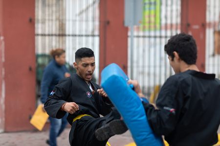Matamoros, Tamaulipas, Mexico - November 20, 2018: The November 20 Parade, Young men practicing martial arts during the paradeのeditorial素材