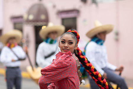 Matamoros, Tamaulipas, Mexico - November 20, 2018: The November 20 Parade, Young women and men dancing wearing traditional mexican clothing during the paradeのeditorial素材