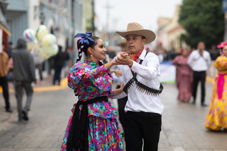 Matamoros, Tamaulipas, Mexico - November 20, 2018: The November 20 Parade, Young women and men dancing wearing traditional mexican clothing during the paradeのeditorial素材
