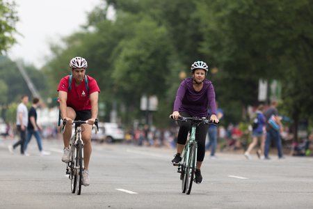 Couple on bicycles, ride on the streets of downtown washington dc