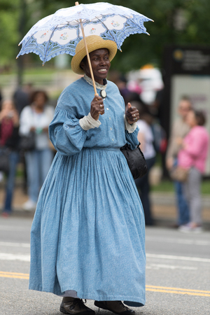 Washington, D.C., USA - May 28, 2018: The National Memorial Day Parade, Women dress up with civil war era clothing. walking down constitution avenue during the paradeのeditorial素材