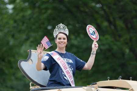 Washington, D.C., USA - May 28, 2018: The National Memorial Day Parade, MS Veteran America 2017 on top a military vehicle waving the american flagのeditorial素材
