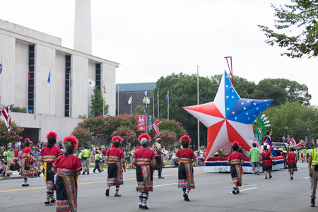 Washington, D.C., USA - July 4, 2018, The National Independence Day Parade, Taiwanese women wearing traditional clothing, walking down constitution avenue during the paradeのeditorial素材