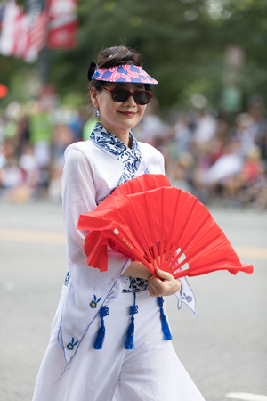 Washington, D.C., USA - July 4, 2018, The National Independence Day Parade, Taiwanese women wearing traditional clothing, walking down constitution avenue during the paradeのeditorial素材