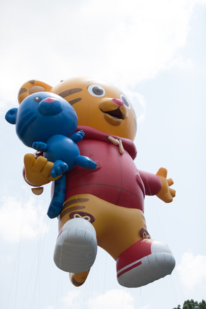 Washington, D.C., USA - July 4, 2018, The National Independence Day Parade, Balloon in shape of Daniel Tiger, going down constitution avenueのeditorial素材