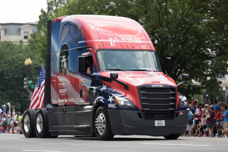 Washington, D.C., USA - July 4, 2018, The National Independence Day Parade, Truck painted in the colors of the american flag and carrying a national flag, going down constitution avenueのeditorial素材