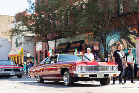 Chicago, Illinois, USA - September 15, 2018: Pilsen Mexican Independence Day Parade, Chevrolet, Chevelle, with mexican flags, going down the streetのeditorial素材