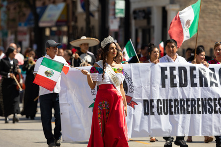 Chicago, Illinois, USA - September 15, 2018: Pilsen Mexican Independence Day Parade, Mexican beauty queen, wearing a crown, going down the street during the paradeのeditorial素材
