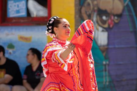 Chicago, Illinois, USA - September 15, 2018: Pilsen Mexican Independence Day Parade, Mexican woman, wearing traditional clothing, going down the streetのeditorial素材