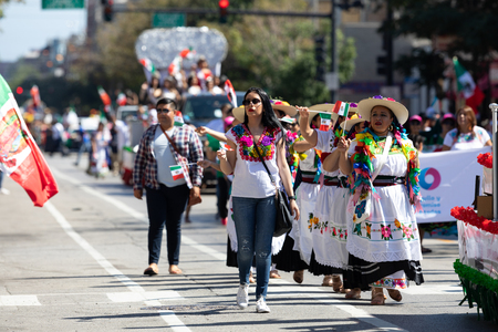 Chicago, Illinois, USA - September 15, 2018: Pilsen Mexican Independence Day Parade, Mexican woman, wearing traditional clothing, going down the streetのeditorial素材