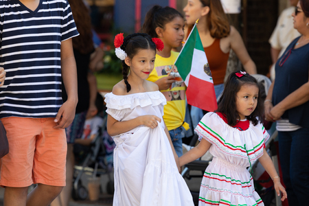 Chicago, Illinois, USA - September 15, 2018: Pilsen Mexican Independence Day Parade, Mexican girl, wearing traditional clothing, going down the streetのeditorial素材