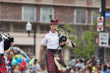 Louisville, Kentucky, USA - May 03, 2018: The Pegasus Parade, Members of the Louisville fire and rescue pipes and drums band, marching down W Broadwayのeditorial素材