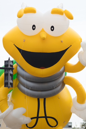 Louisville, Kentucky, USA - May 03, 2018: The Pegasus Parade, Giant balloon in shape of Louie The Lightning Bug, going down the streetのeditorial素材