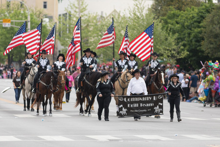 Louisville, Kentucky, USA - May 03, 2018: The Pegasus Parade, Members of the Company B Drill Team from Hardin County, Kentucky, Riding horses and carrying American flagsのeditorial素材