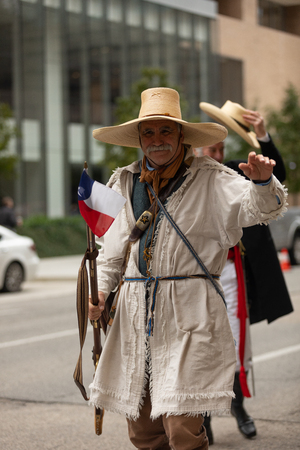 Houston, Texas, USA - November 11, 2018: The American Heroes Parade, Men wearing early Settlers outfits, and carrying Muskets, walking down the streetのeditorial素材