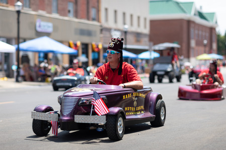 Jasper, Indiana, USA - August 5, 2018: The Strassenfest Parade, Members of Hadi Shriners Motor Corps from Evansville, Indiana, driving mini cars with the american flagのeditorial素材