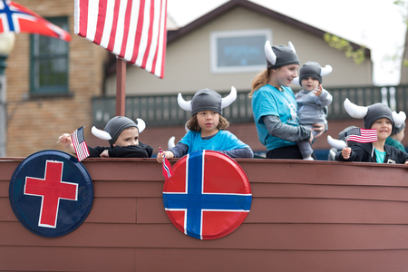 Stoughton, Wisconsin, USA - May 20, 2018: Annual Norwegian Parade, Children with viking helmets, riding on a float in shape of a ship, from the Lakeview churchのeditorial素材