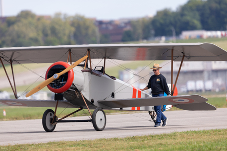 Dayton, Ohio, USA - September 23, 2018: World War I Dawn Patrol Rendezvous, Nieuport 12, being pushed by a man along the runwayのeditorial素材
