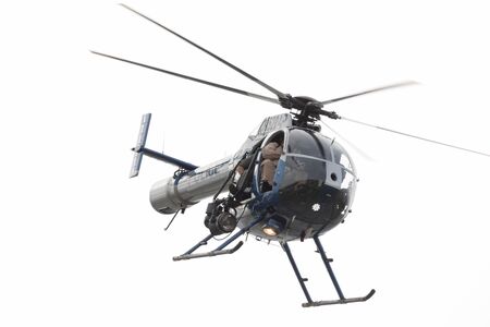 Louisville, Kentucky, USA - April 13, 2019: Thunder Over Louisville, Louisville Metro Police Department LMPD Air Operations MD 520N performing a recue demostration on the Ohio Riverのeditorial素材