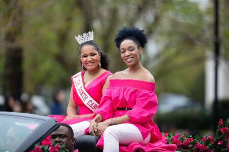 Wilmington, North Carolina, USA - April 6, 2019: The North Carolina
Azalea Festival, Miss North Carolina Teen, riding on a car going down 3rd street at the paradeのeditorial素材