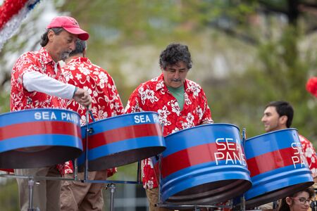 Wilmington, North Carolina, USA - April 6, 2019: The North CarolinaAzalea Festival,  Members of the Sea Pans playing steel drums during the paradeのeditorial素材
