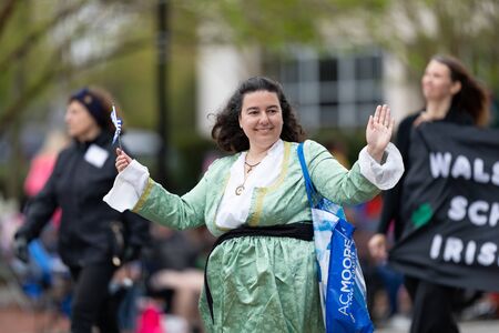 Wilmington, North Carolina, USA - April 6, 2019: The North CarolinaAzalea Festival, People of diferent cultures wearing traditional clothing going down 3rd street during the paradeのeditorial素材