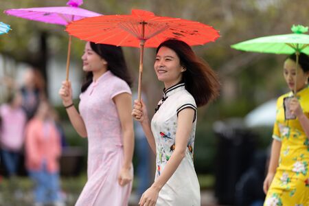Wilmington, North Carolina, USA - April 6, 2019: The North CarolinaAzalea Festival, People of diferent cultures wearing traditional clothing going down 3rd street during the paradeのeditorial素材