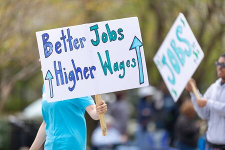 Wilmington, North Carolina, USA - April 6, 2019: The North Carolina
Azalea Festival, People promoting StepUp, demanding jobs with better wages, and benefits at the paradeのeditorial素材