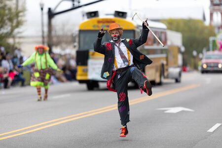 Wilmington, North Carolina, USA - April 6, 2019: The North Carolina
Azalea Festival, Members of the Dunn Clowns Sudan Shriners, going down 3rd street at the paradeのeditorial素材