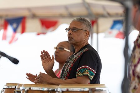 Wilmington, North Carolina, USA - April 6, 2019: The North Carolina
Azalea Festival, Members of the African-American Dance Ensemble performing at the Azalea festivalのeditorial素材